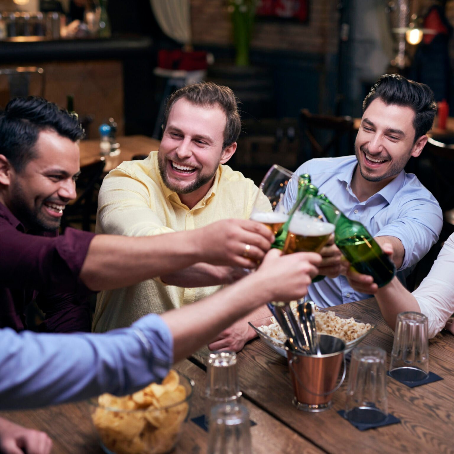Men making a cheers for good weekend